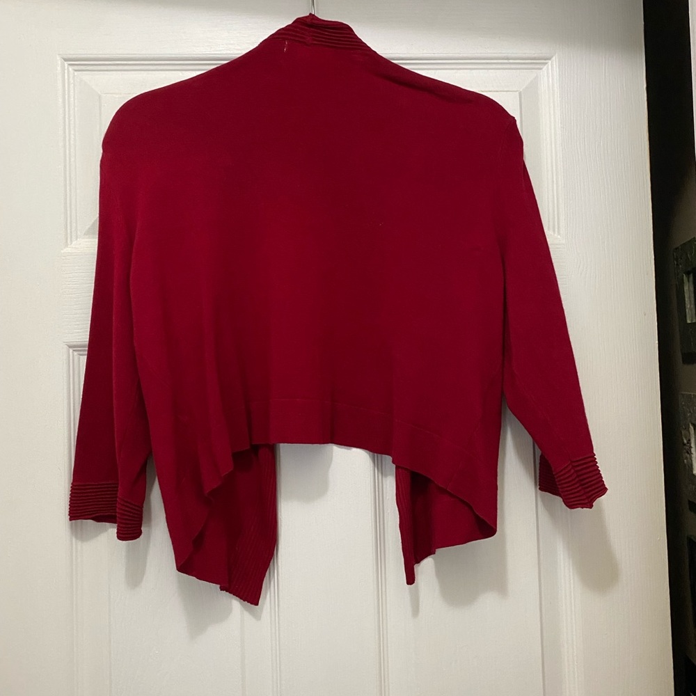 Three quarter length sleeves. Mid length Sweater
